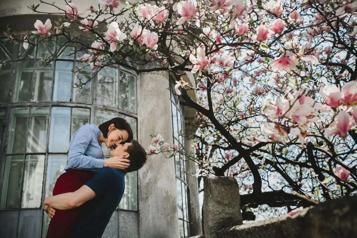 lovely-young-couple-stands-blooming-tree-outside-hug-each-other-tender