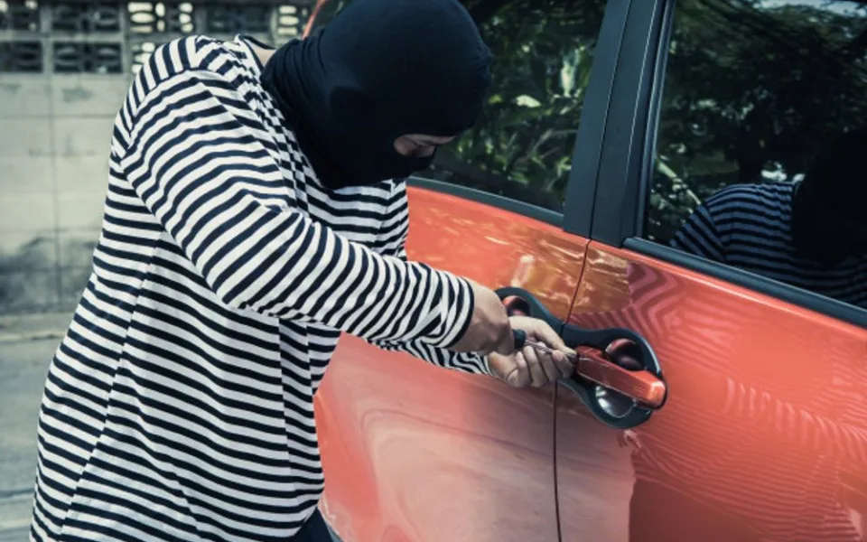 thieves-try-use-screwdriver-open-car-door-steal-car-while-owner-car-does_34755-100